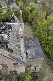Elevated view from crane, looking down onto fire damaged building.