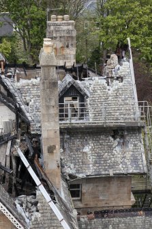 Elevated view from crane, looking down onto fire damaged building.