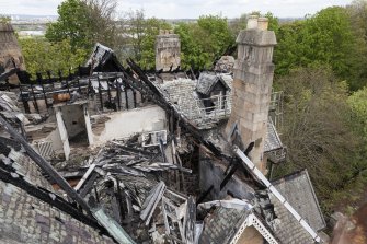 Elevated view from crane, looking down onto fire damaged building.