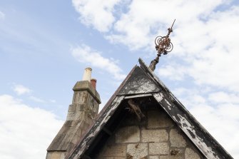 Elevated view from crane, looking up at gablehead and finial.