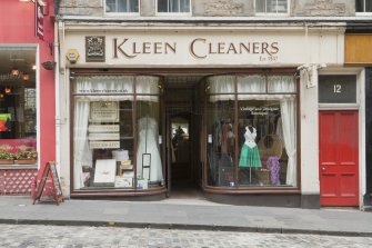  View of Kleen Cleaners shop front, 10-14 St Mary's Street, Edinburgh, from W.
