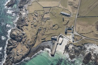 Oblique aerial view of Hynish, Tiree, looking SW.
