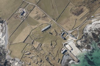 Oblique aerial view of Hynish, Tiree, looking W.