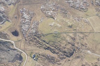 Oblique aerial view of Dun Mor a' Chaolais, Millton, Tiree, looking SW.