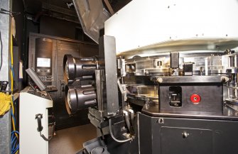 Interior. Detail view of lens arrangement on projector.