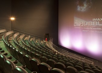 Interior. General view of seating and screen in cinema.