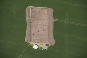Oblique aerial view of the enclosure under excavation, looking NNW.