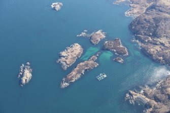 Oblique aerial view of Eilean an Achaidh and the site of the Drumbeg wreck, looking ENE.