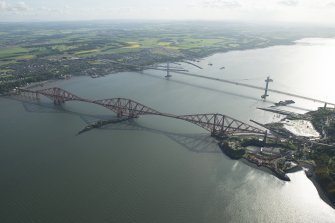 General oblique aerial view of the Forth Bridge, the Forth Road Bridge and the construction of the Queensferry Crossing, looking SW.