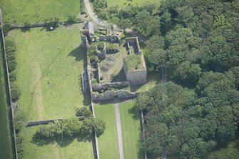 Oblique aerial view of Pitsligo Castle, looking E.