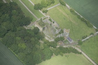 Oblique aerial view of Pitsligo Castle, looking NW.