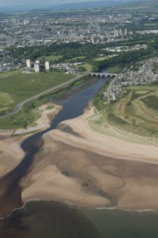 General oblique aerial view of the mouth of the River Don with the Bridge of Don and St Ninian's Place tower blocks in the background, looking SW.