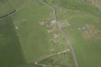 Oblique aerial view of Tershinty Camp on the former site of Fraserburgh Airfield, looking NW.