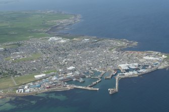 Oblique aerial view of Fraserburgh and Fraserburgh Harbour, looking NW.