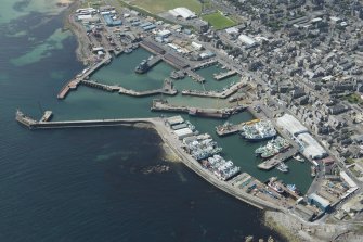 Oblique aerial view of Fraserburgh Harbour, looking SW.