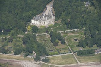 Oblique aerial view of Dunrobin Castle and walled garden, looking NNW.