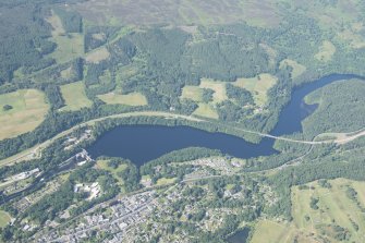 Oblique aerial view of Pitlochry, Power Station and Dam, Coronation Bridge and Loch Faskally Reservoir, looking WSW.