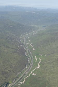 General oblique aerial view of the Pass of Drumochter showing the route of the Creiff to Dalnacardoch Military Road and the construction of the Beauly to Denny power line, looking N.