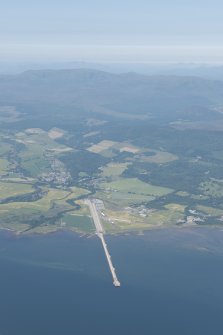 Oblique aerial view of  Evanton Airfield and quay, looking WNW.