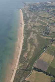 Oblique aerial view of Brora Golf Course, looking S.