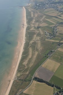 Oblique aerial view of Brora Golf Course, looking S.