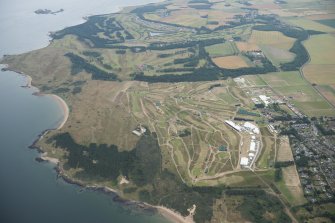 General oblique aerial view of Muirfield golf course showing the set up for the Open Championship 2013, looking ENE.