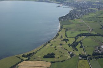 General oblique aerial view of Stranraer Golf Course with the town beyond, looking SE.