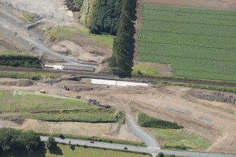 Oblique aerial view of the works along the A75 Dunragit Bypass to the SW of Dunragit village, looking S.