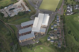 Oblique aerial view of Biggar High School, looking NNW.