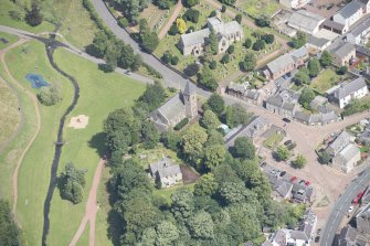 Oblique aerial view centred on the former Moat Park Church, looking NE.