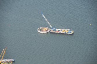Oblique aerial view of the bridge supports under construction, looking WNW.
