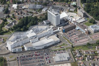 Oblique aerial view of Victoria Hospital, Kirkcaldy, looking ENE.