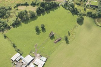 Oblique aerial view of Gilbertfield Castle, looking SE.