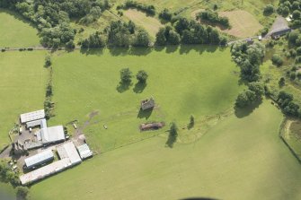 Oblique aerial view of Gilbertfield Castle, looking ESE.