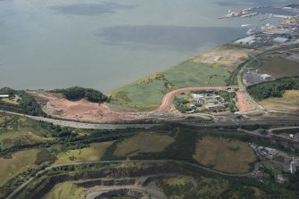 Oblique aerial view of the Queensferry Crossing under construction centred on the approach to the north bank, looking ESE.