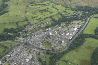 General oblique aerial view of Langholm and the golf course, looking E.