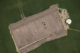 Oblique aerial view centred on the Glasgow University excavations at Leadketty, looking NE.