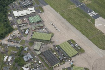Oblique aerial view of Leuchars Airfield technical site, looking ESE.