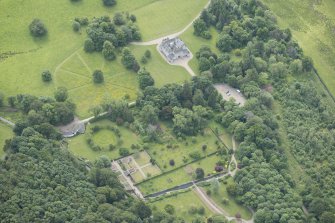 Oblique aerial view of Leith Hall and policies, looking to the SE.