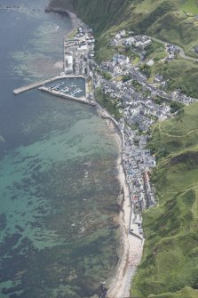 Oblique aerial view of Gardenstown and harbour, looking to the NE.