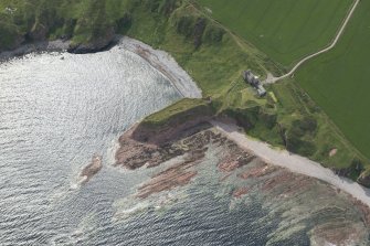 Oblique aerial view of Dundarg Castle, looking to the SE.