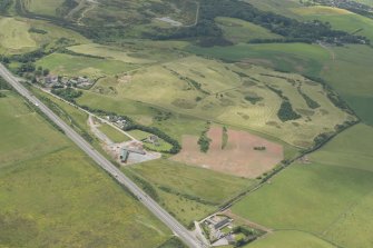 Oblique aerial view of the East Aberdeenshire golf course, looking to the WSW.