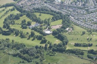 General oblique aerial view of Prestonfield House and golf course, looking S.