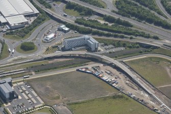Oblique aerial view of Cultins Road centred on the tramworks, looking SE.