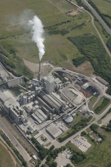 Oblique aerial view of Oxwellmains Cement Works at Dunbar, looking S.