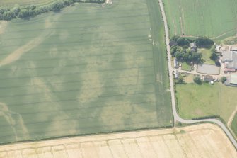Oblique aerial view of the cropmarks of the cursus, enclosure and linear features at Preston Mains, looking W.