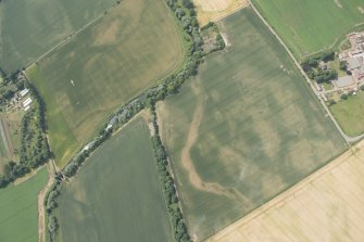 Oblique aerial view of the cropmarks of the cursus and other features at Preston Mains, looking W.