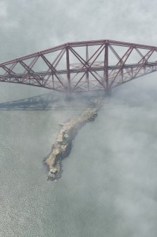 Oblique aerial view of the Forth Bridge centred on Inchgarvie, looking W.