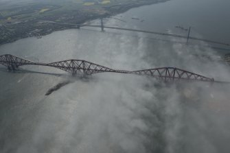 General oblique aerial view of the Forth Bridge and the road bridge, looking W.