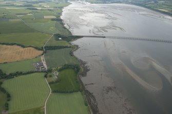 General oblique aerial view of the fish traps, pier and enclosures in the Cromarty Firth, looking SW.